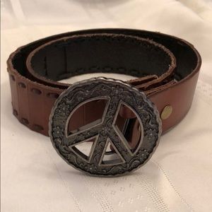 Leather belt with peace sign buckle.
